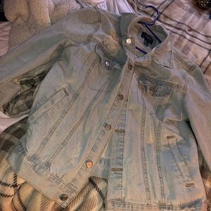 jean jacket , cute rips in elbows.